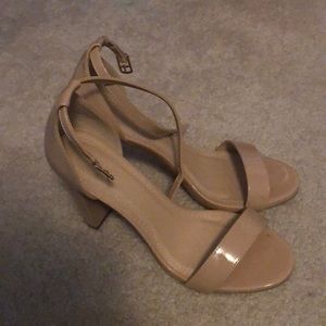 Tan high heels with a heel of about 3 inches
